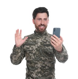 Happy soldier using video chat on smartphone against white background. Military service