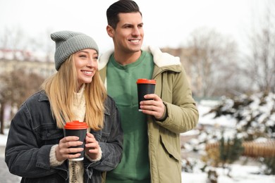 Beautiful happy couple outdoors on winter day