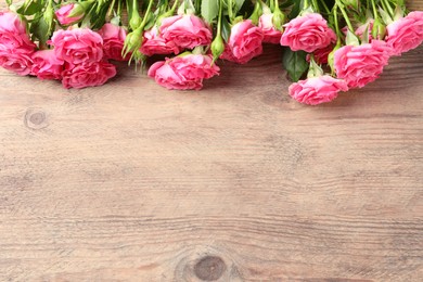 Photo of Happy Mother's Day. Beautiful flowers on wooden table, above view. Space for text