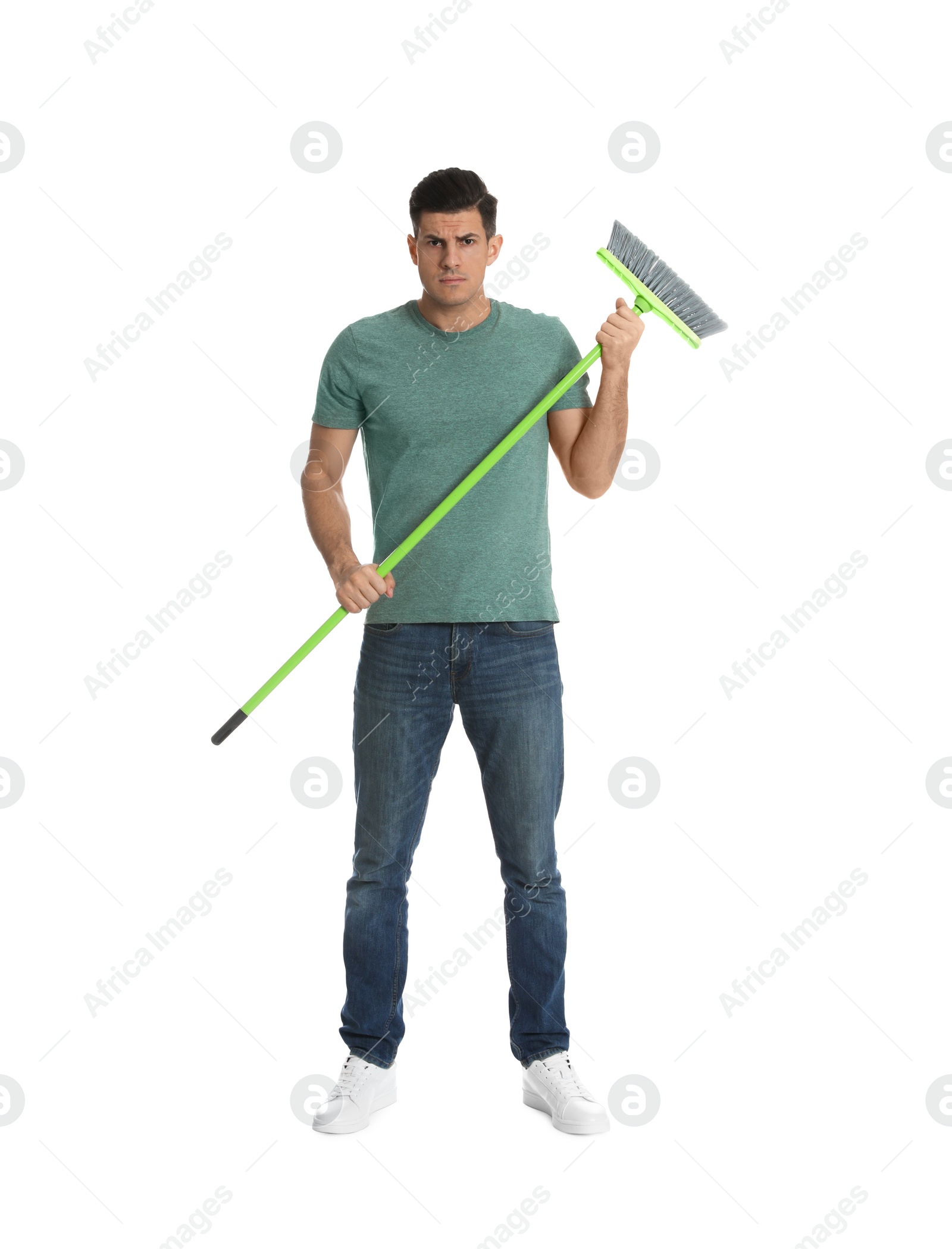 Photo of Man with green broom on white background