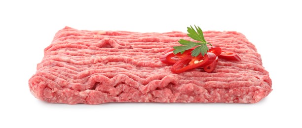 Photo of Raw ground meat, chili pepper and parsley isolated on white