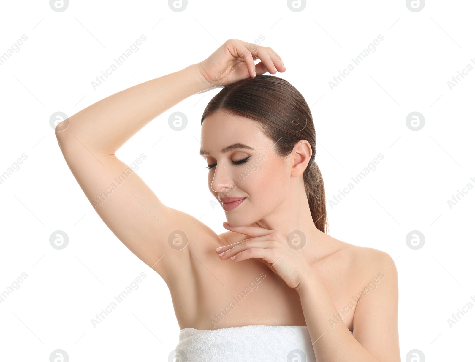 Photo of Young beautiful woman showing armpit with smooth clean skin on white background