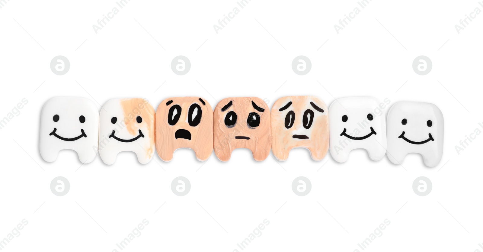 Photo of Decorative healthy and damaged teeth on white background, top view