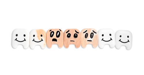 Photo of Decorative healthy and damaged teeth on white background, top view