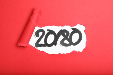 Photo of Numbers 20 and 80 on white background, view through hole in red paper. Pareto principle concept