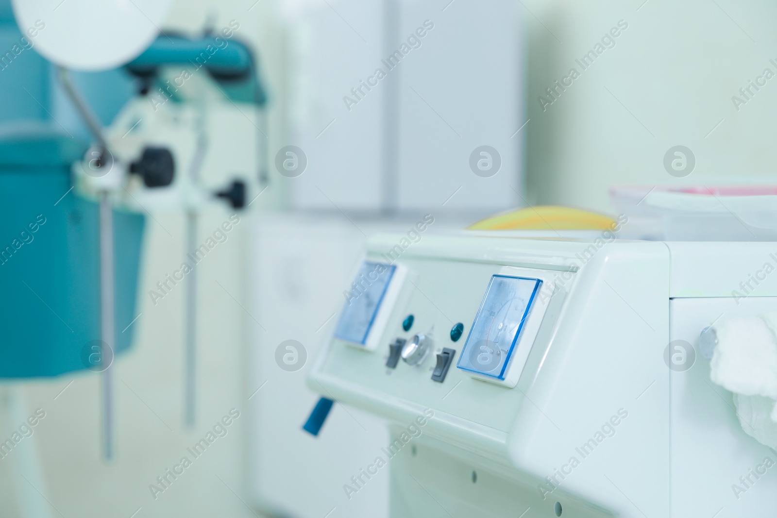 Photo of Gynecological examination. Modern medical aspirator for artificial abortion in clinic, closeup. Space for text