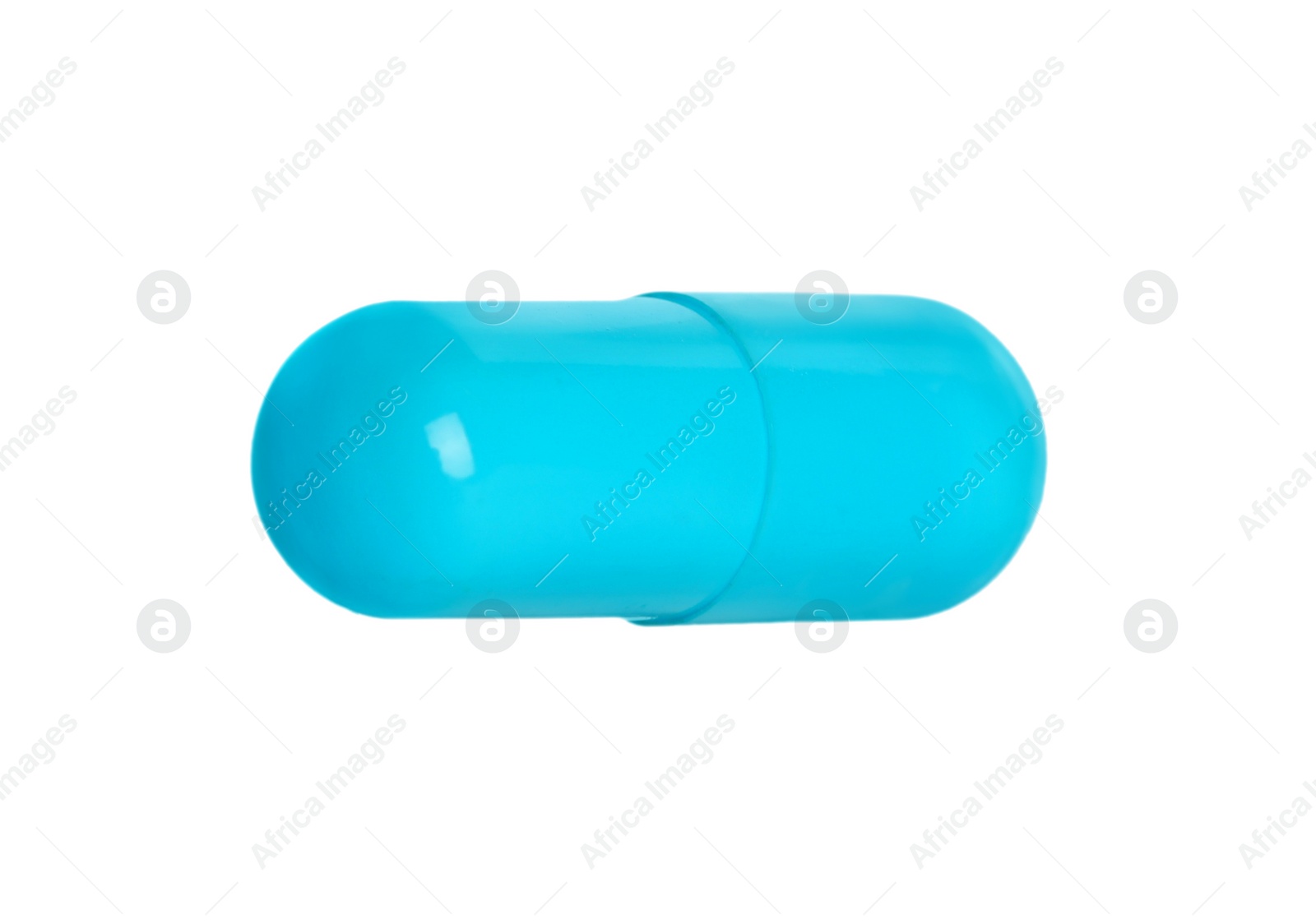 Photo of One light blue pill on white background. Medicinal treatment