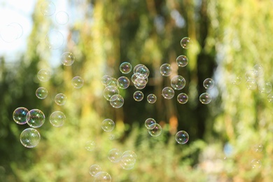 Beautiful translucent soap bubbles outdoors on sunny day