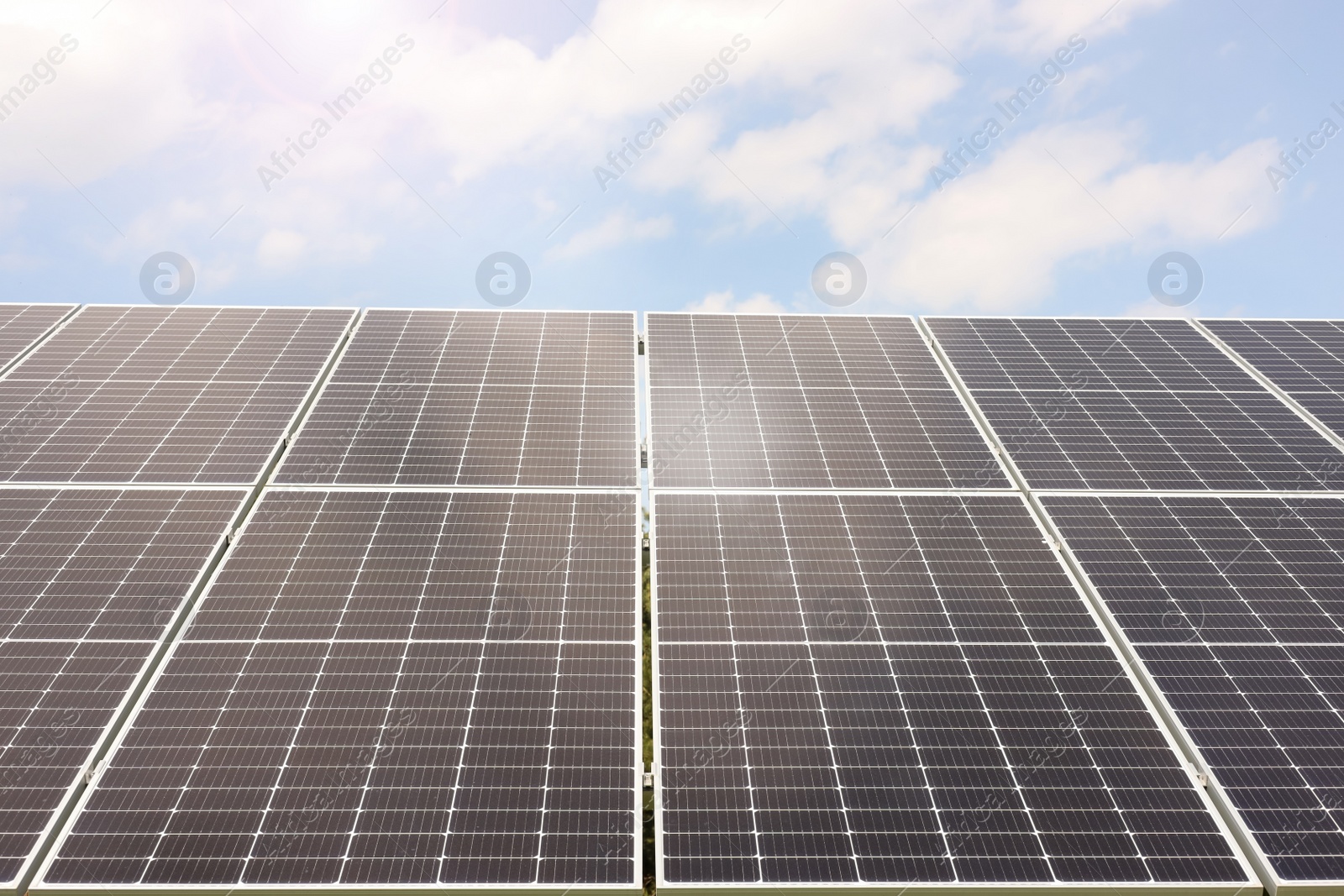 Photo of Solar panels outdoors on sunny day. Alternative energy