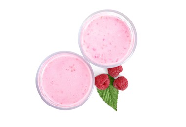 Photo of Tasty raspberry smoothie in glasses on white background, top view