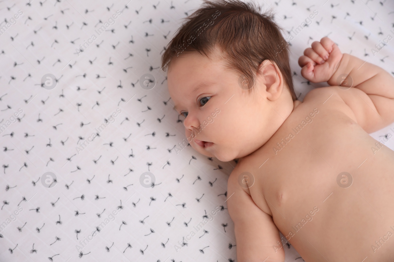 Photo of Cute little baby lying on blanket, top view with space for text. Bedtime