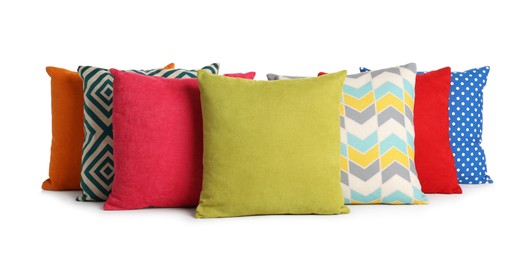 Different colorful decorative pillows on white background