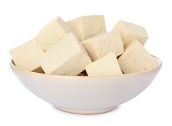 Photo of Bowl with delicious raw tofu pieces on white background