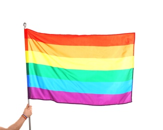 Photo of Gay man holding rainbow LGBT flag on white background