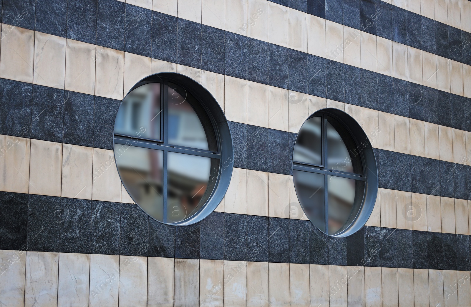 Photo of Facade of modern building with round windows