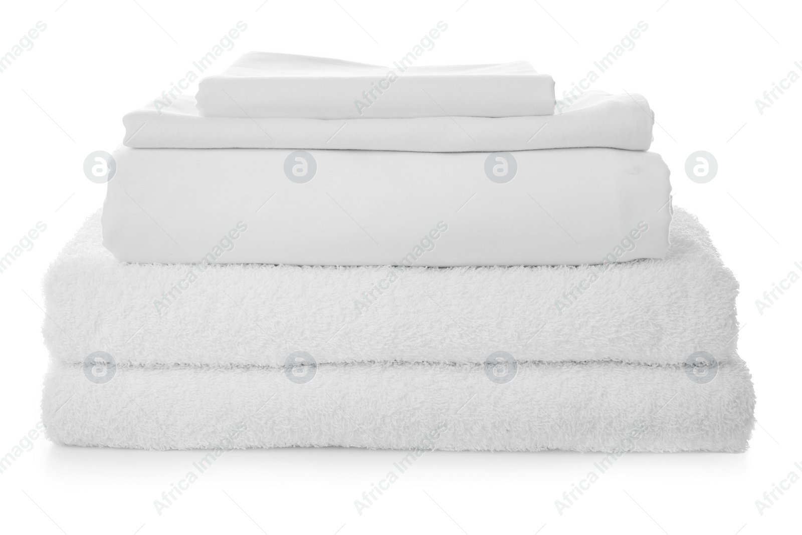 Photo of Stack of towels and bed sheets on white background