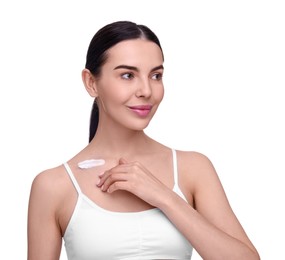 Photo of Beautiful woman with smear of body cream on her collarbone against white background