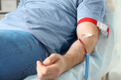 Man donating blood to save someone's life in hospital