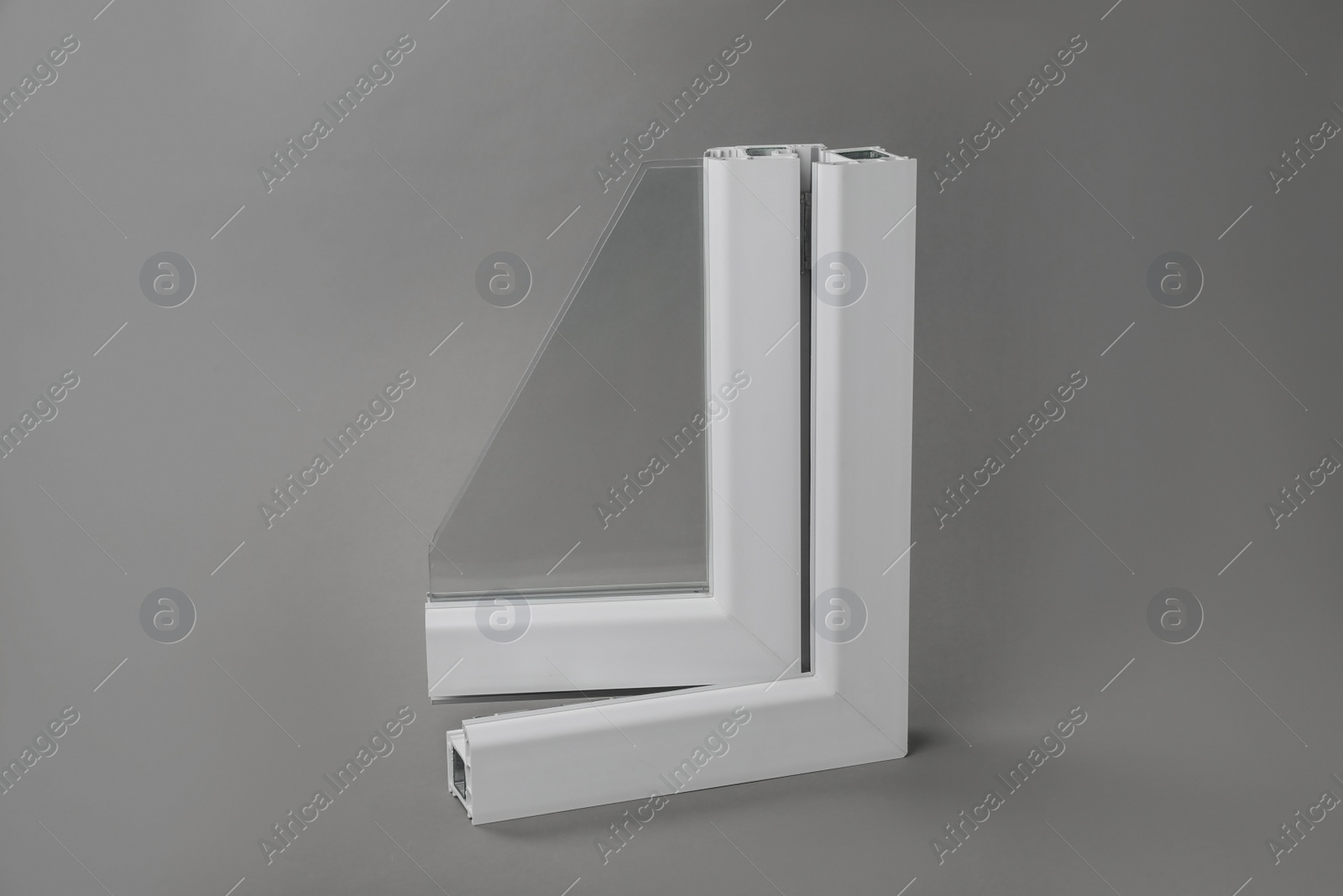 Photo of Sample of modern window profile on grey background