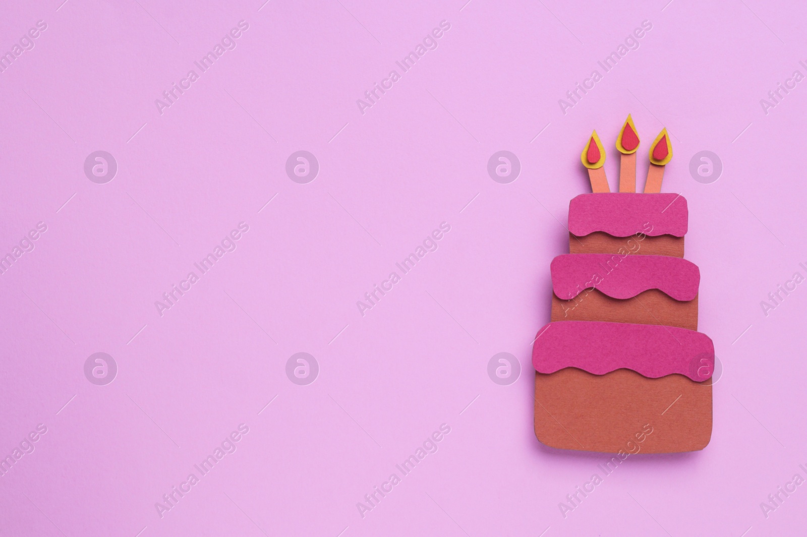Photo of Birthday party. Paper cake with candles on pink background, top view. Space for text