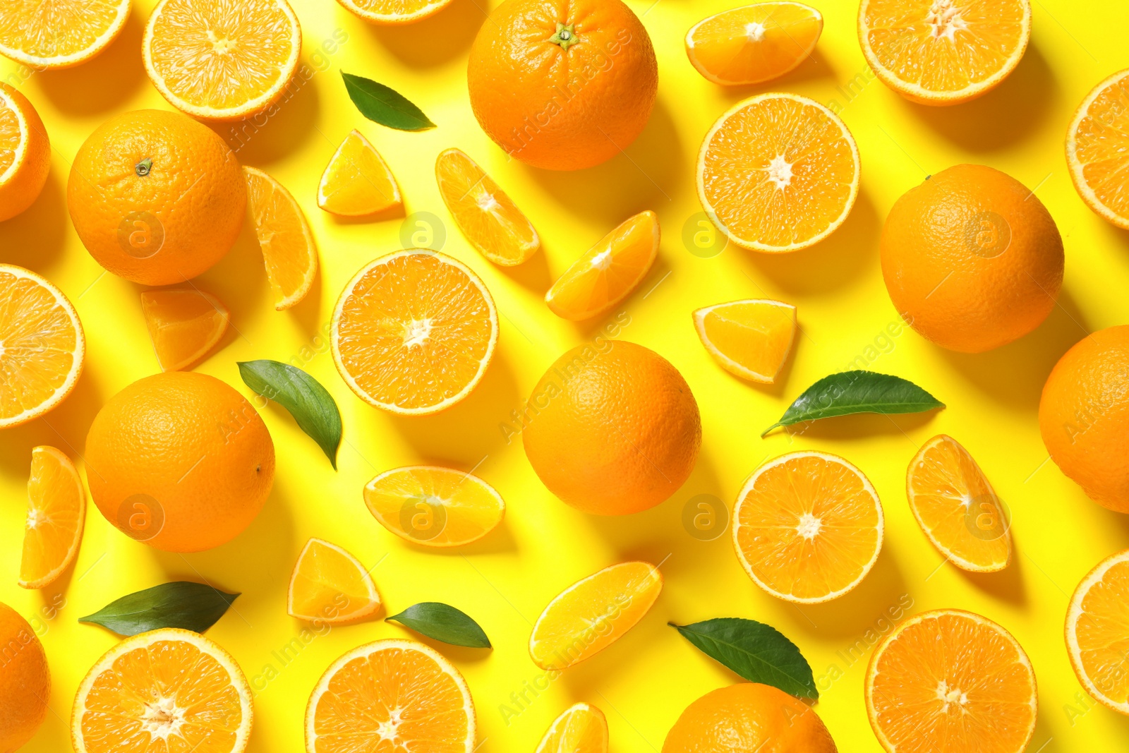 Photo of Flat lay composition with ripe oranges on color background