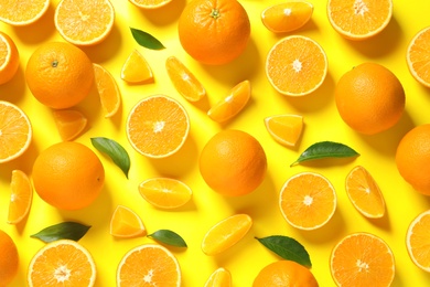 Photo of Flat lay composition with ripe oranges on color background