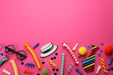 Photo of Flat lay composition with carnival items on pink background. Space for text