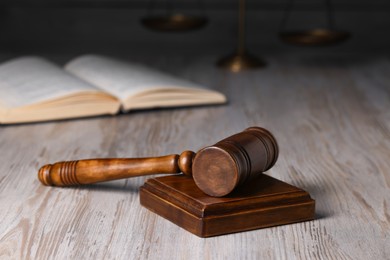 Photo of Law concept. Judge's gavel on light wooden table