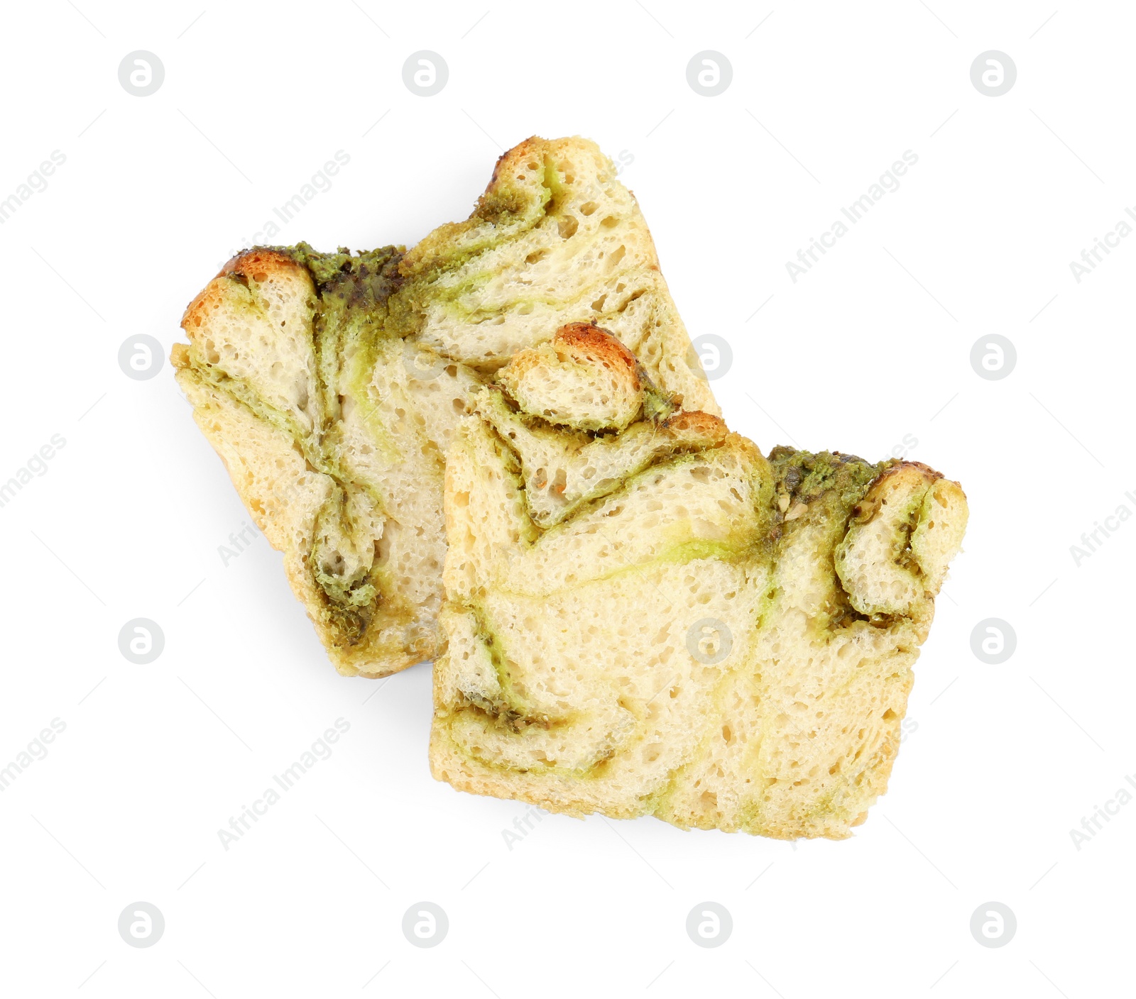 Photo of Slices of freshly baked pesto bread isolated on white, top view