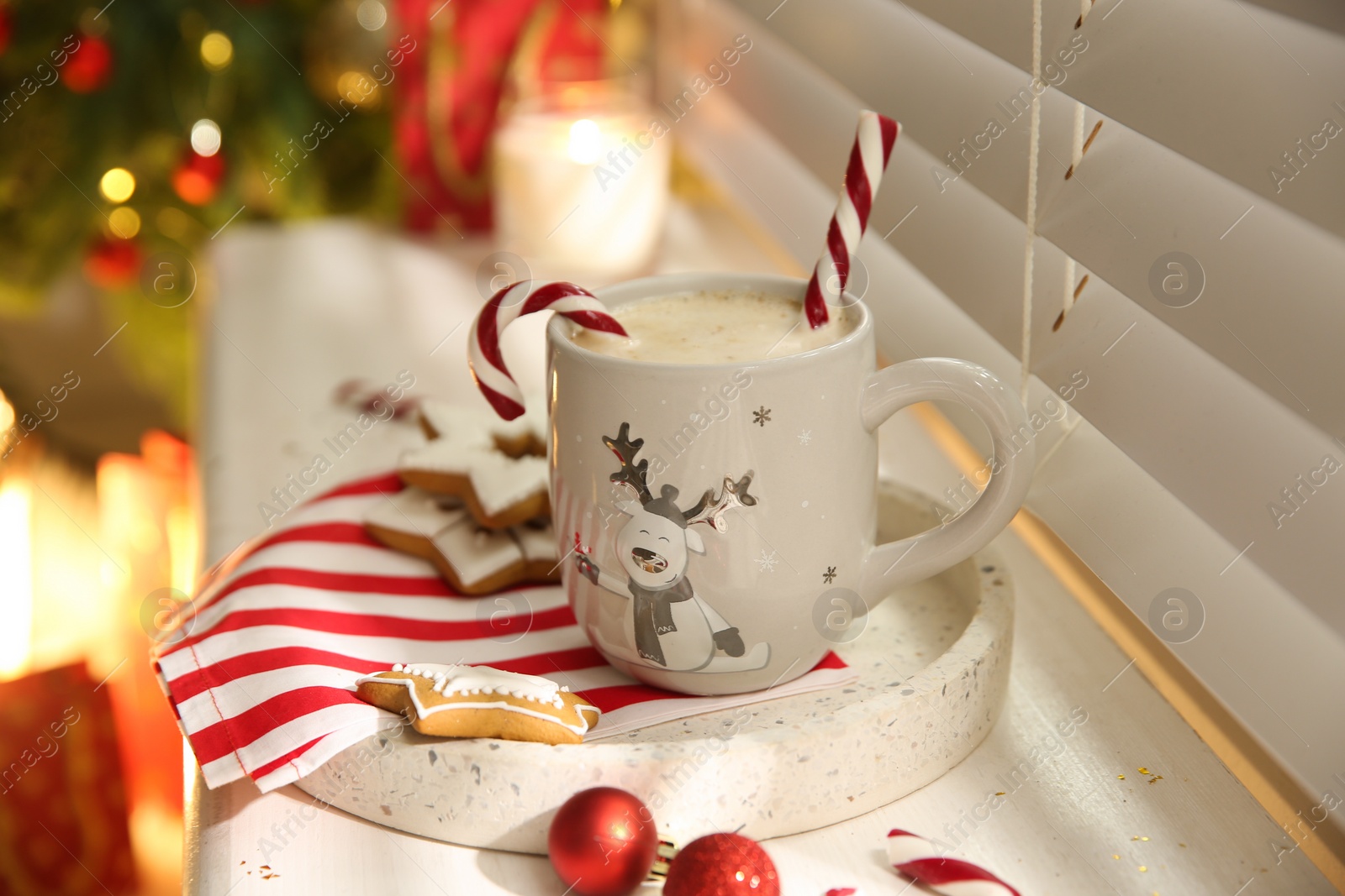 Photo of Composition with cup of hot drink on windowsill