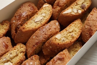 Photo of Traditional Italian almond biscuits (Cantucci) in box, closeup