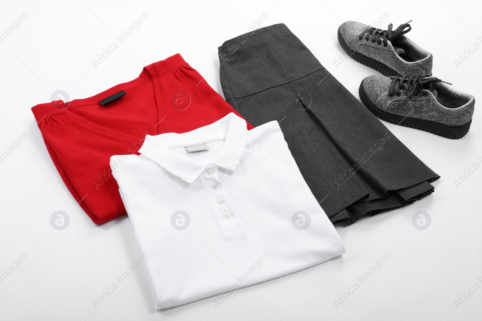 Photo of New stylish school uniform on white background