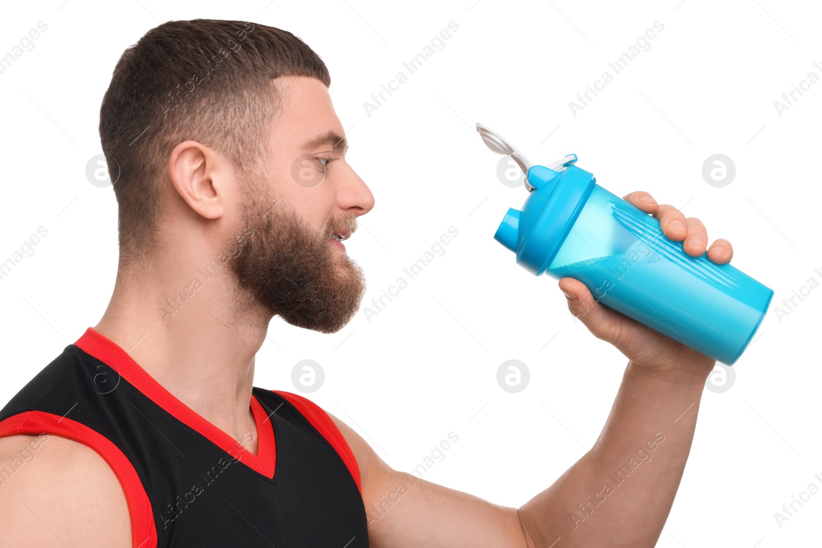 Photo of Young man with muscular body holding shaker of protein on white background