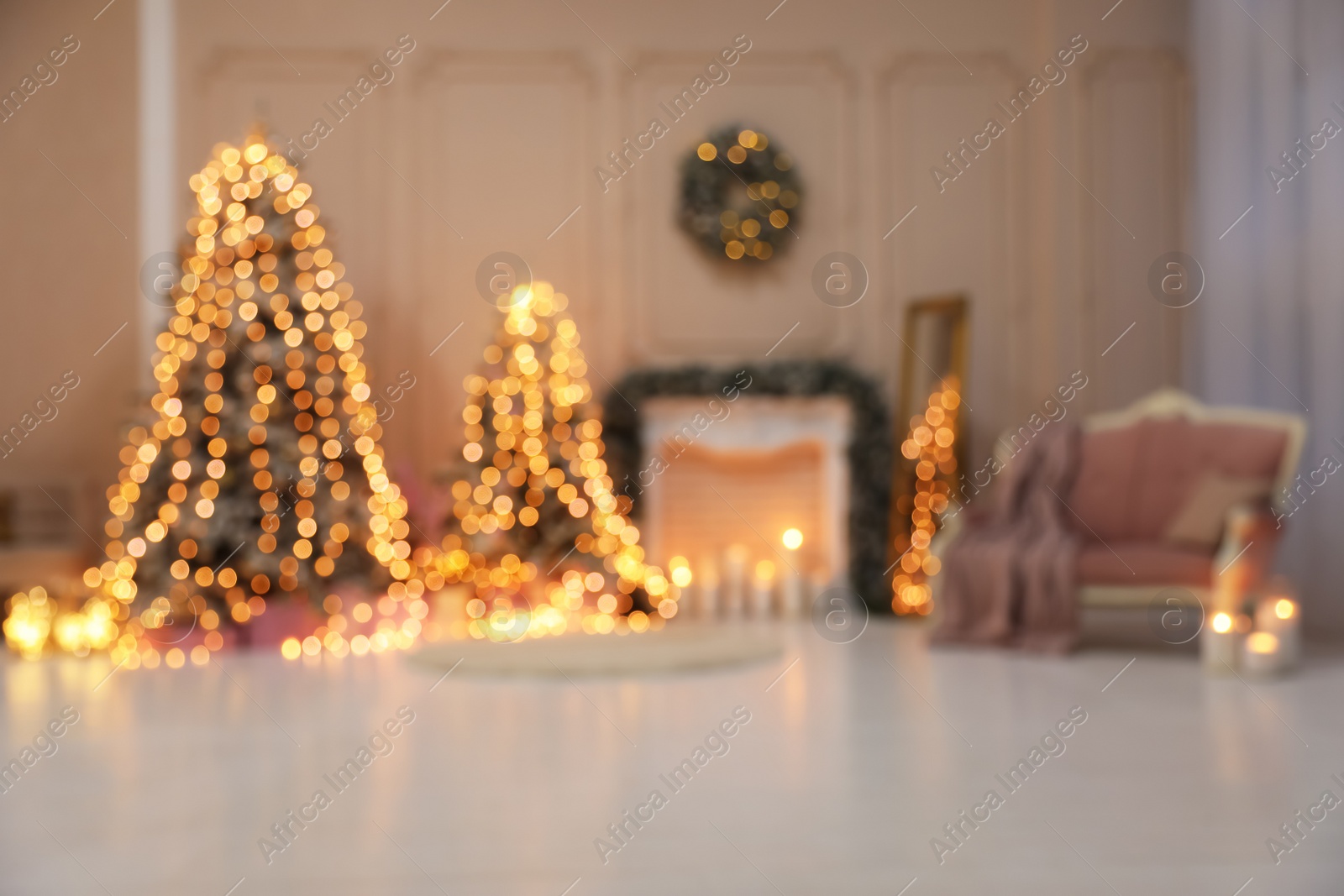 Photo of Blurred view of festive room interior with Christmas trees