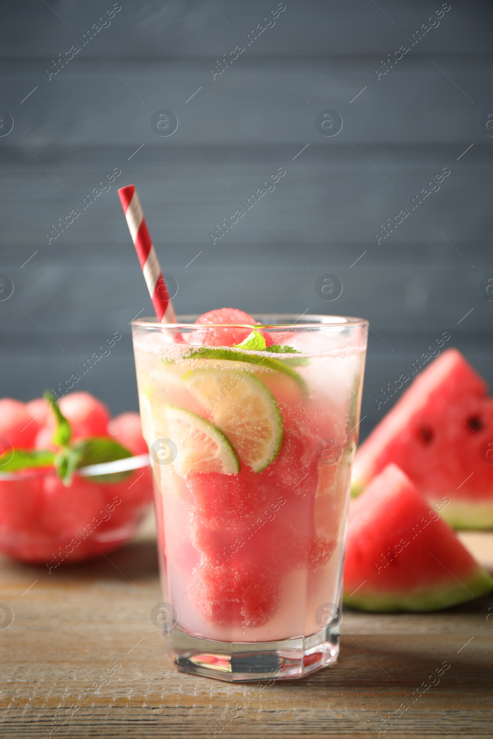 Photo of Glass of refreshing watermelon drink on wooden table