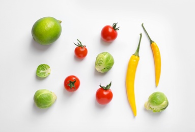 Fresh vegetables and fruit on white background, top view