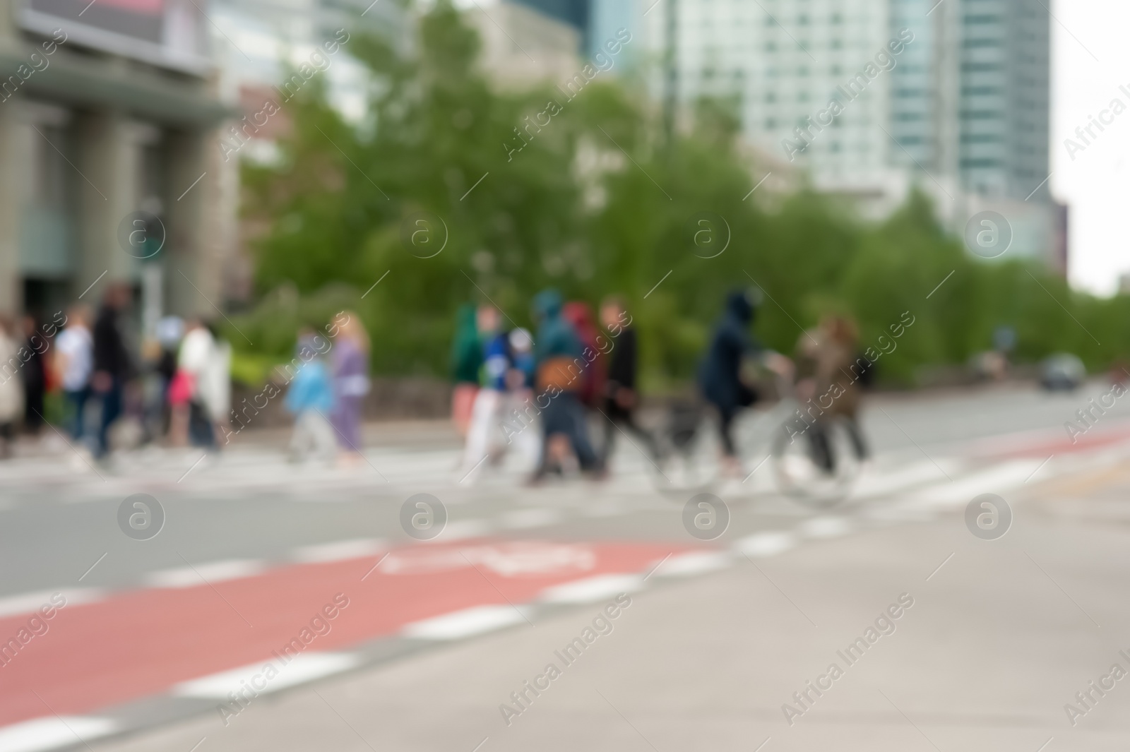 Photo of People crossing street in city, blurred view