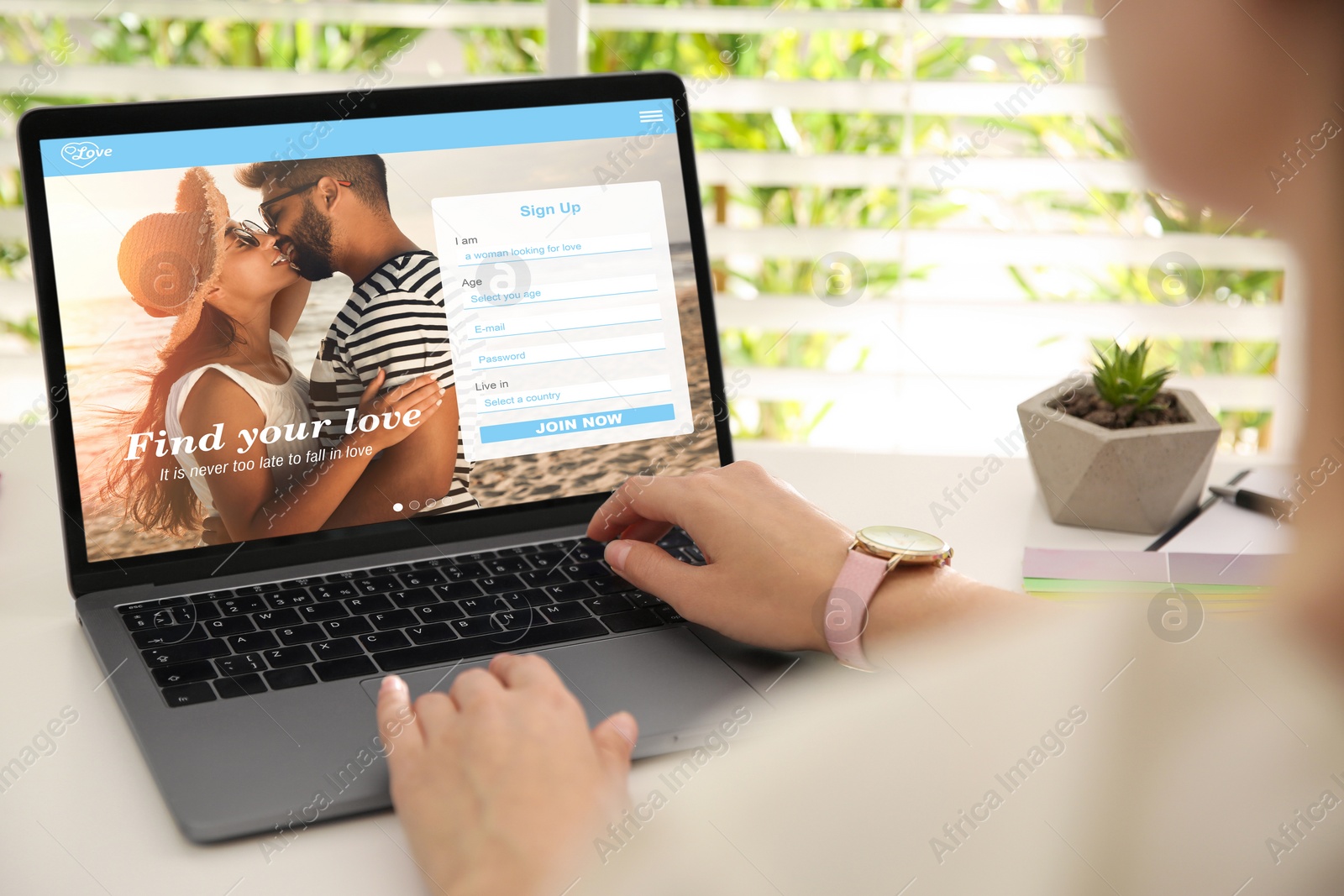 Image of Looking for partner. Woman creating account on dating site via laptop, closeup