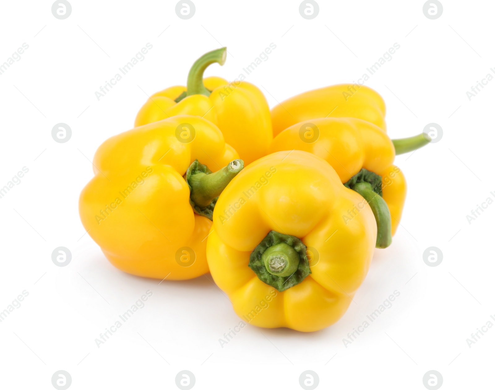 Photo of Ripe yellow bell peppers isolated on white