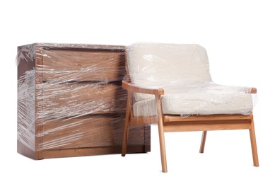 Armchair and chest of drawers wrapped in stretch film on white background