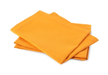 Photo of New clean orange cloth napkins isolated on white