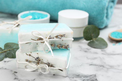 Natural handmade soap bars on marble table
