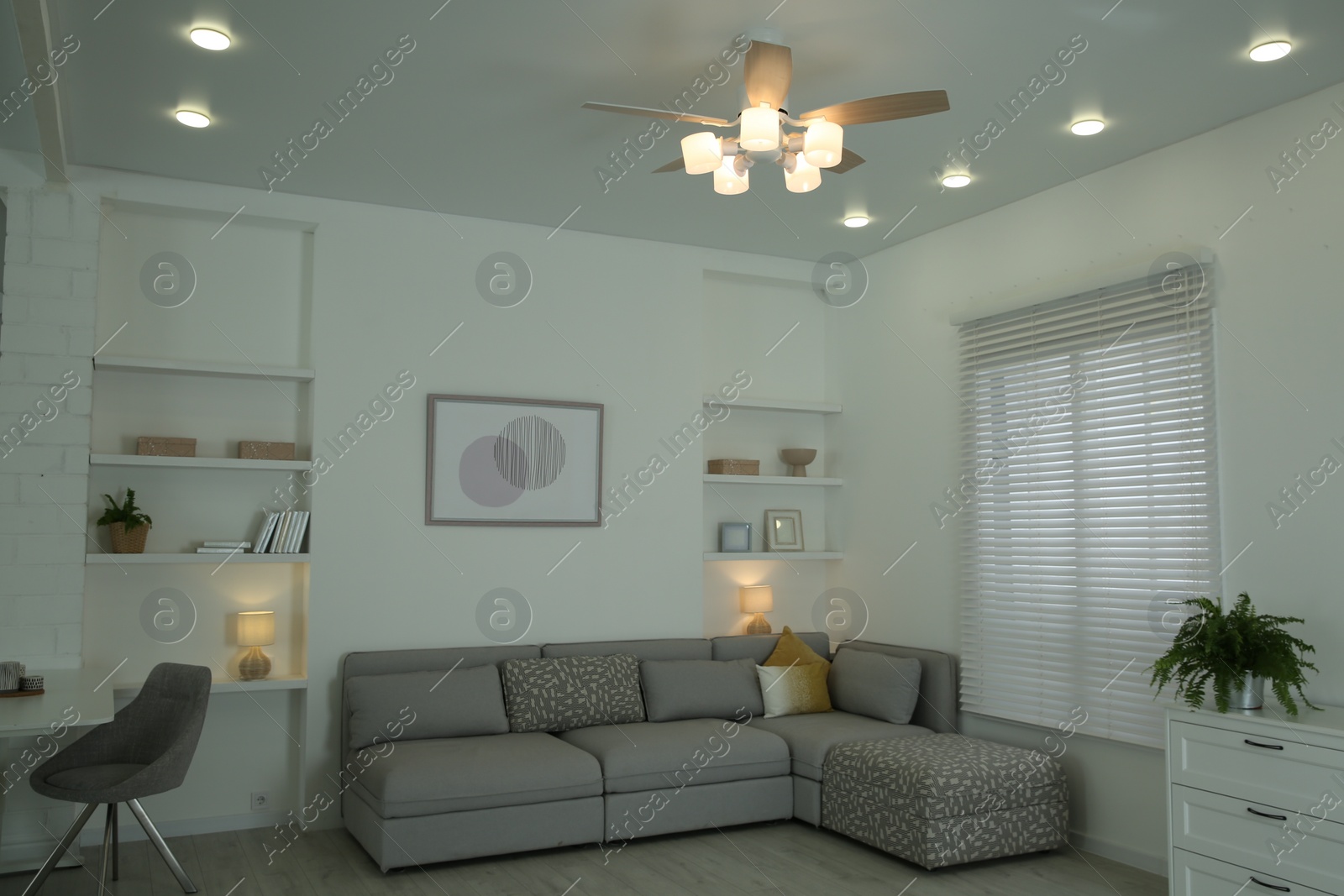 Photo of Ceiling fan, furniture and accessories in stylish living room