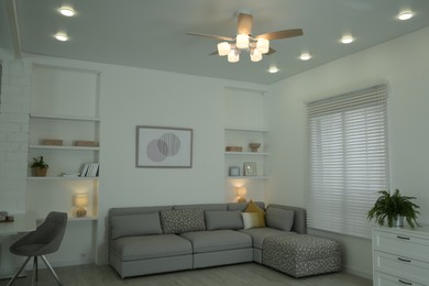 Ceiling fan, furniture and accessories in stylish living room