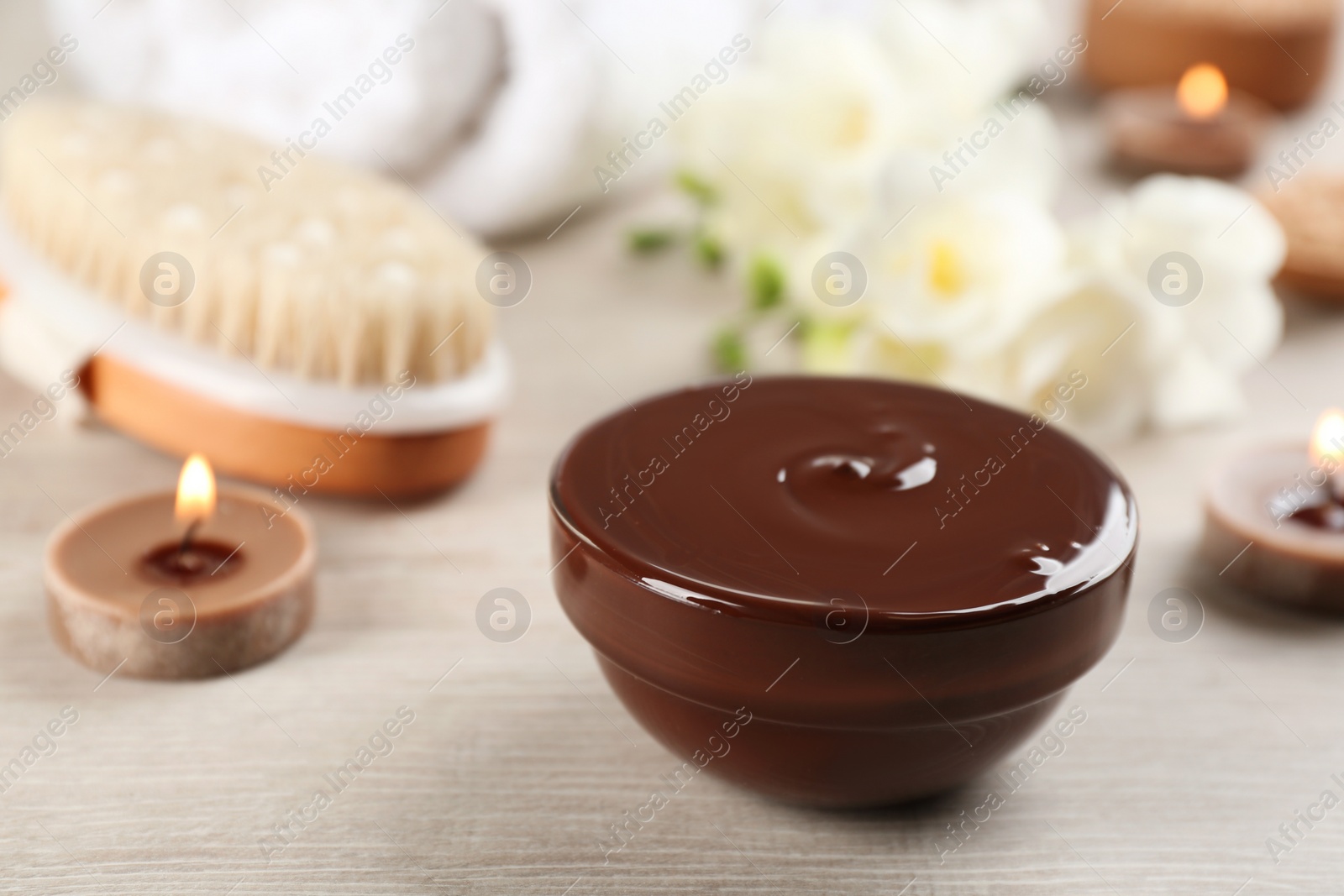 Photo of Composition with cosmetic product for spa body wraps on light wooden background