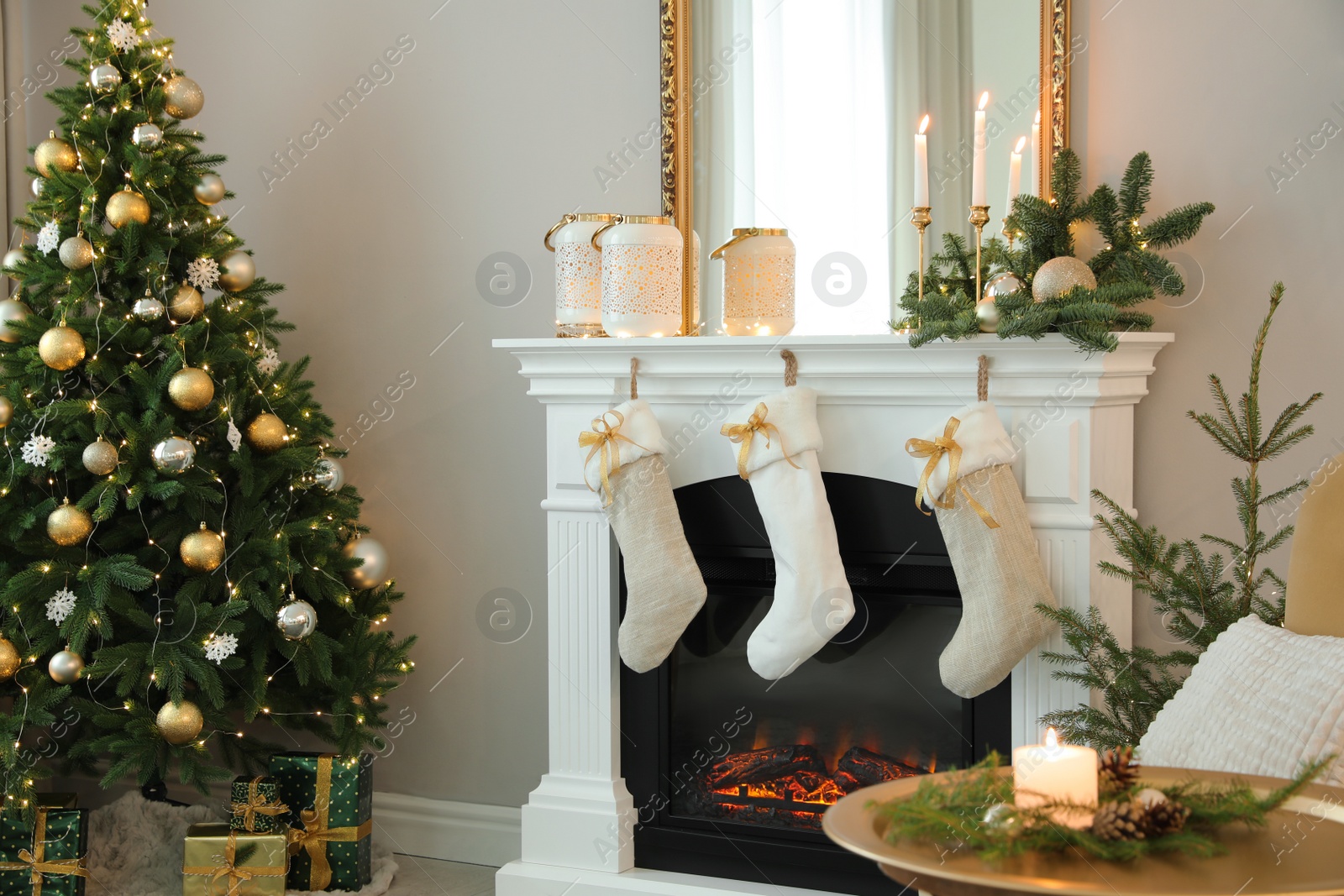 Photo of Beautiful living room interior with burning fireplace. Christmas celebration