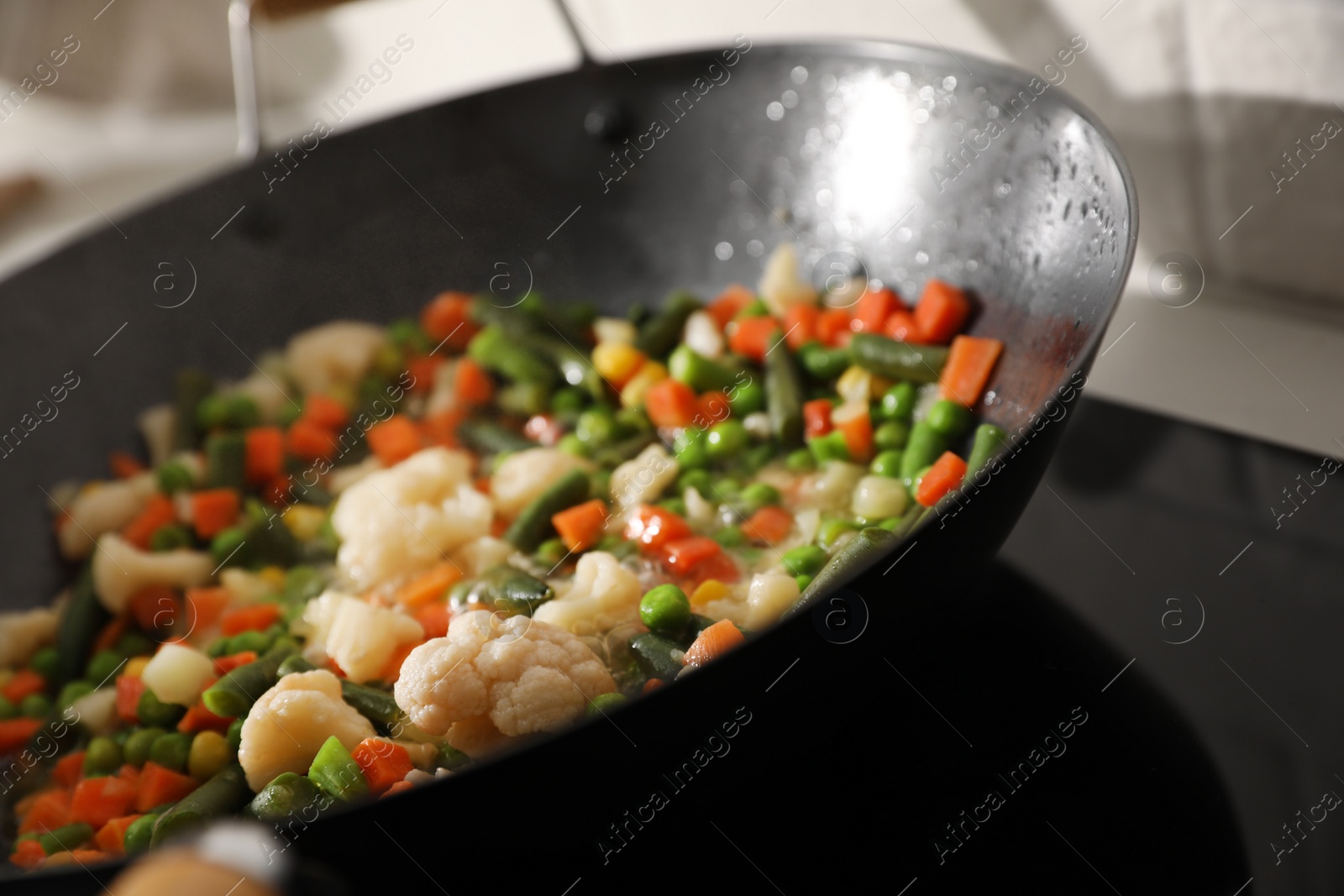 Photo of Frying pan with mix of fresh vegetables, closeup