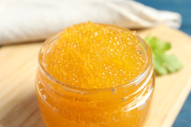 Fresh pike caviar in glass jar on table, closeup