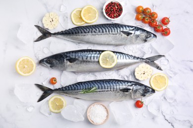 Flat lay composition with tasty raw mackerel on white marble table