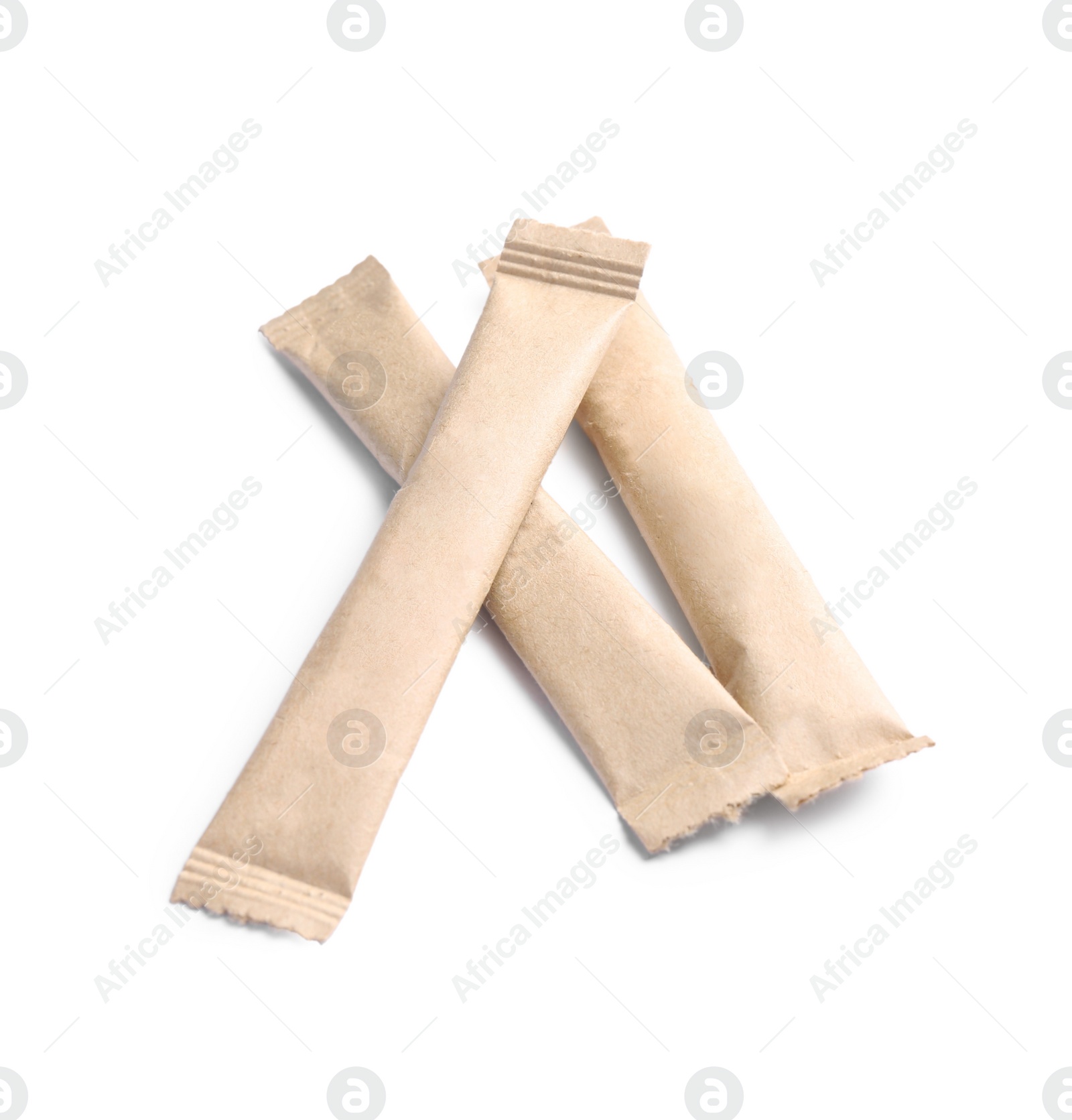 Photo of Beige sticks of sugar on white background